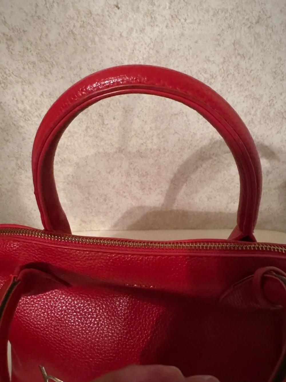 bebe Red Pebbled Fabiola Leather Satchel with Gold Logo Accent with strap.